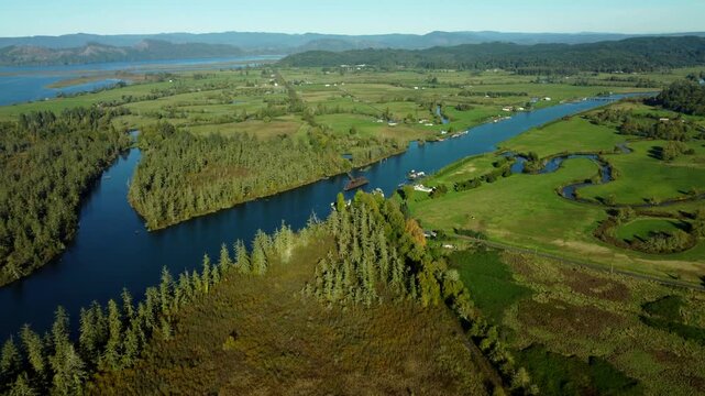 US, OR, Knappa, 2025-10-21 - Drone view of an abandoned railroad trestle on a tributary of the Columbia River.