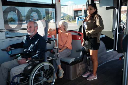 Diverse people traveling public transport for accessibility - Powered by Adobe