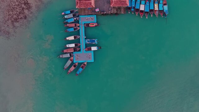 aerial 4k shot of Ao Nam Mao pier with boats