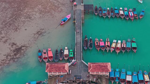 aerial 4k shot of Ao Nam Mao pier with boats