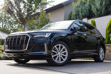 Modern subcompact hybrid crossover car SUV. Exterior details. Large size wheels. Exterior of electric hybrid suv car. Car for sale and rent business. Sustainable Mobility in automotive industry