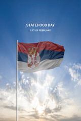 Waving flag of Serbia in beautiful blue sky for National holiday