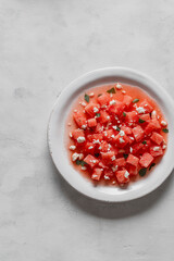 Salad made with watermelon, feta, and mint leaves.