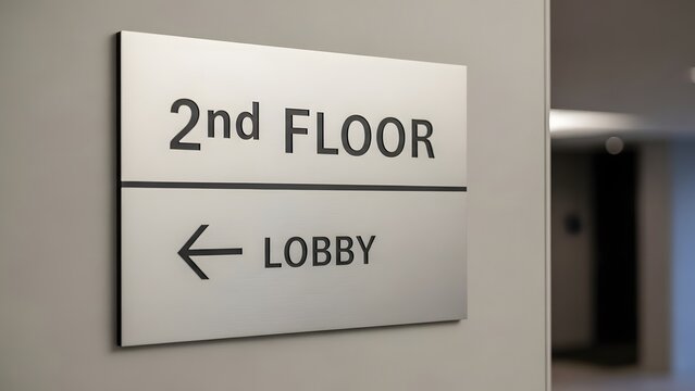 A clear sign or marker indicating the '2nd Floor' location within a commercial building or hotel