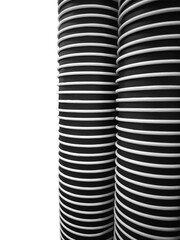 A set of vertically stacked disposable coffee cups, isolated on a transparent background, showcasing a clean geometric pattern ideal for design projects, layouts, and modern compositions.