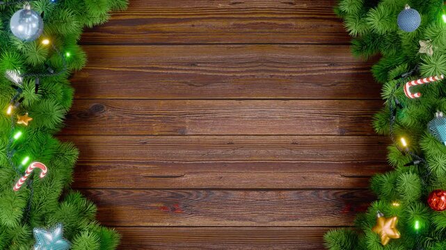 A Christmas or New Year's frame with spruce or pine leaves and flashing lights on a wooden background. Animation in 4K format.