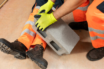 Construction worker was injured in an accident where brick fell on his leg. Request help from co-workers