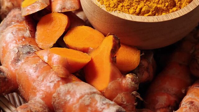 Turmeric powder in a wooden cup