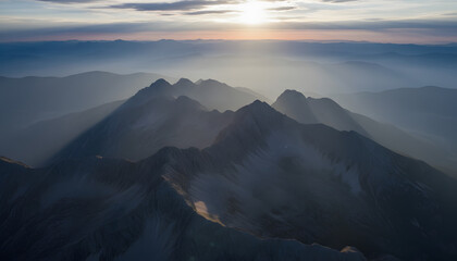 Nature's Beauty: Majestic sunrise landscape over the mountain peaks with blue sky and dramatic clouds