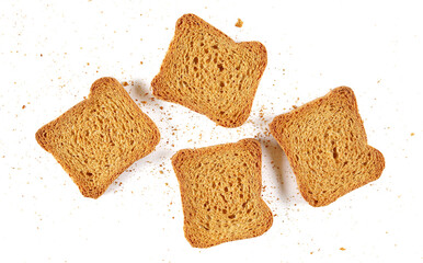 Integral slices, rusks with wholewheat flour, sliced whole wheat dry bread with crumbs isolated on white background, top view