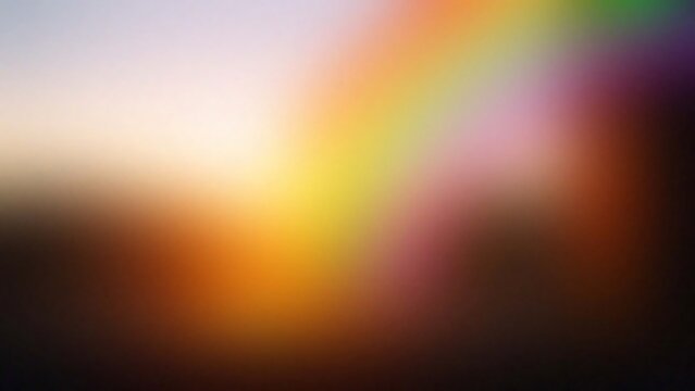 Abstract blurry background with vibrant rainbow colors and soft sunlight