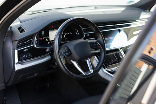 Empty cockpit electric diesel hybrid vehicle, Head Up Display and digital speedometer. Steering wheel of electric vehicle cockpit electric buttons. Autonomous car. Driverless car. Self-driving vehicle