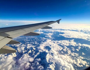 Obraz premium View from an airplane window, high above snowy mountains