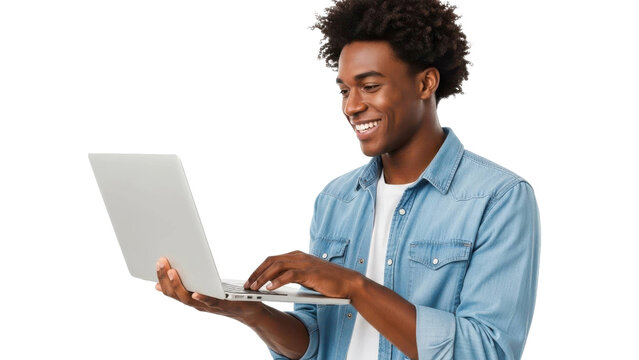 Young Black man smiling while using laptop