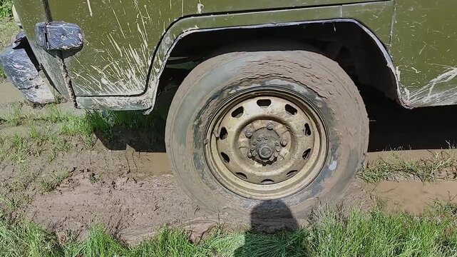 the car is spinning on a dirty road