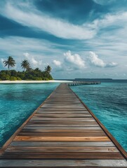 Fototapeta premium A long wooden pier leading into the ocean against a backdrop of palm trees and blue skies.