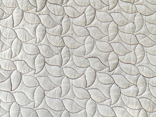 Graphic background of white wallpaper or fabric in random leaves and flower pattern. Seamless background texture.