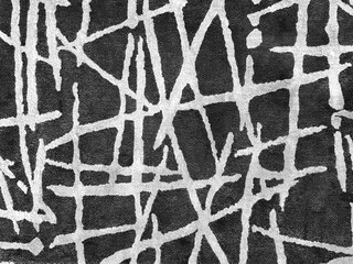 Close up of graphic background of fabric with abstract strokes and lines intersecting each other, in black and white pattern. For wallpaper, upholstery, and carpet or rug. Seamless texture.