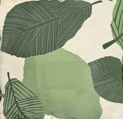 Graphic background in tropical palm leaves pattern, in colorful green, dark green, and white color. Suitable for printed wallpaper and fabric. Seamless background texture.