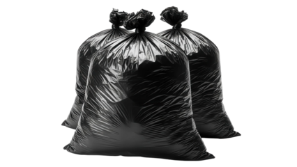 Three full black trash bags isolated on black