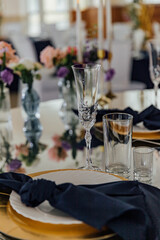 Elegant table setting with floral centerpiece and crystal glassware for a sophisticated event.