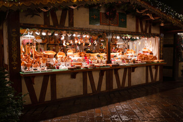 Christmas market at night in Trier, Germany, booth with food and decoration, advent time in winter season, december 3rd 2025