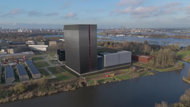 Aerial Orbit Around Modern Data Center by the Water
