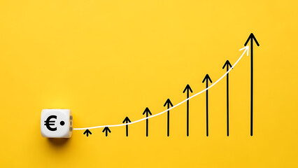 Euro currency symbol on dice with upward trending graph on yellow background