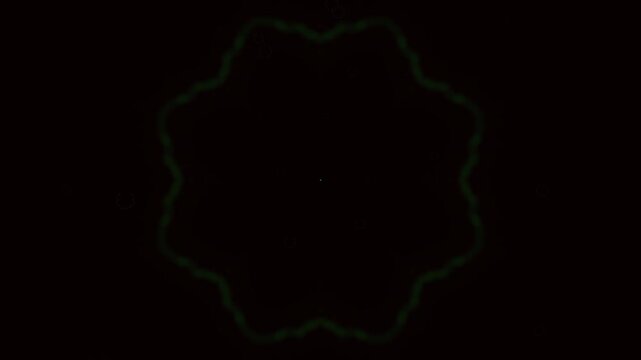 Dim green glowing flower-like shape animation