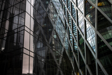 Reflection layered across modern architecture and skyscraper geometry defining the corporate character of urban la defense in paris france’s financial district