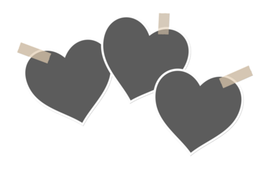 Three hearts taped to a black background