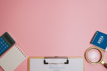 Business chart clipboard calculator notepad calendar magnifying glass on pink background for planning and organization