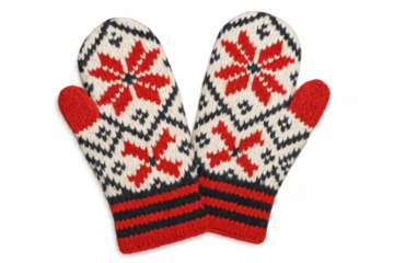 Red and white wool knitted mittens with traditional snowflake pattern creating a warm winter apparel concept