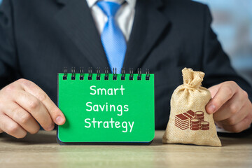 Smart savings strategy concept. Planning finances, tracking expenses, and making informed decisions to maximize savings, reduce costs, and achieve financial goals efficiently. Notepad and money bag