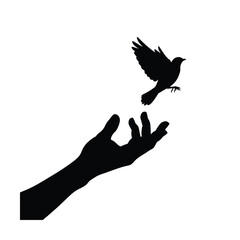 Silhouette of a hand releasing a bird into the sky silhouette