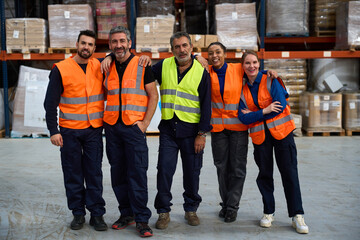 Diverse warehouse team standing together in logistics distribution center