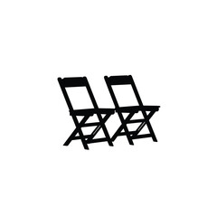 Two black folding chairs in silhouette