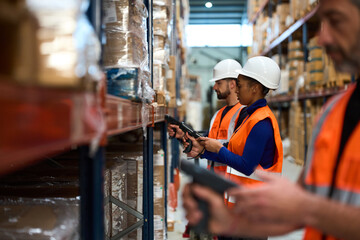Warehouse workers scanning inventory with barcode readers