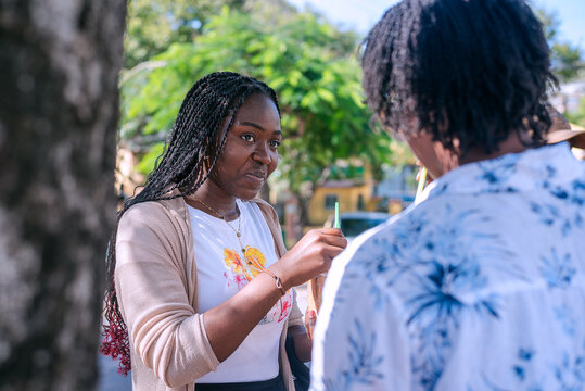 Two beautiful african girls taking a tour in the city