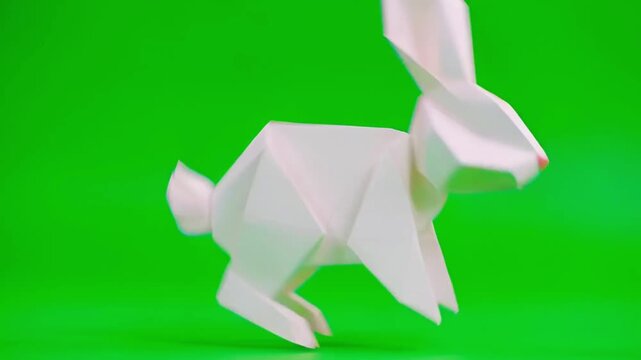 Animation paper origami rabbit on green screen.