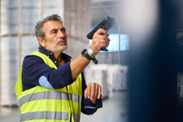 Warehouse worker scanning inventory with barcode reader