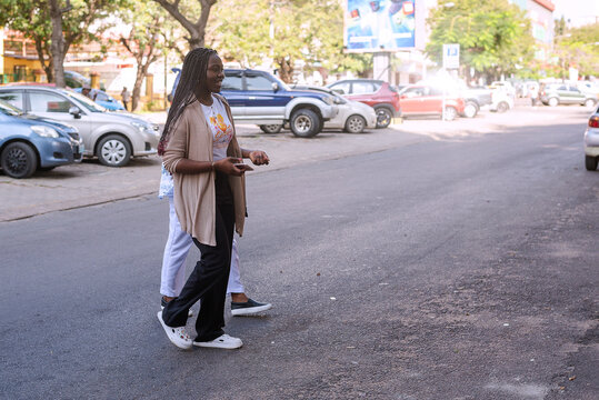 Two beautiful african girls taking a tour in the city