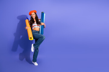 Young stylish woman with colorful tubes posing for fashion and lifestyle shoot against purple background