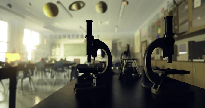 A well lit science classroom features several microscopes on a table, with planetary models suspended from the ceiling, creating an engaging learning environment for students.