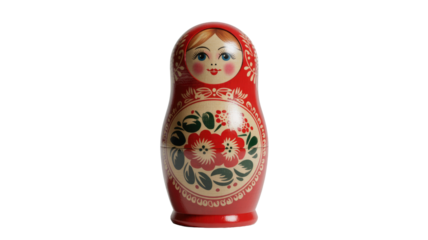 A beautifully painted red Russian nesting doll (Matryoshka) with a smiling face and intricate floral patterns stands against a transparent background. background removed