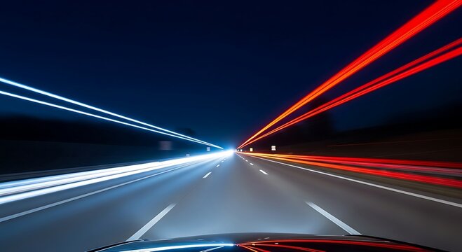 Dynamic long exposure shot of a highway at night, showcasing vibrant light trails from passing vehicles.