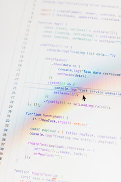 Real-time generated written computer source code in closeup shot on monitor - black letters on white background - concept of digitization, science, research and course of a program script