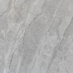 Naklejka premium High-resolution gray marble texture with natural veins and stone surface details, ideal for flooring, wall design, and architecture backgrounds.