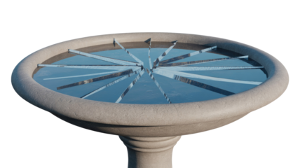A unique stone bird bath with water and radially arranged reflective shards resembling shattered glass, creating an abstract artistic display. background removed