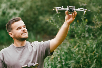 Young man demonstrating drone for UAV lessons